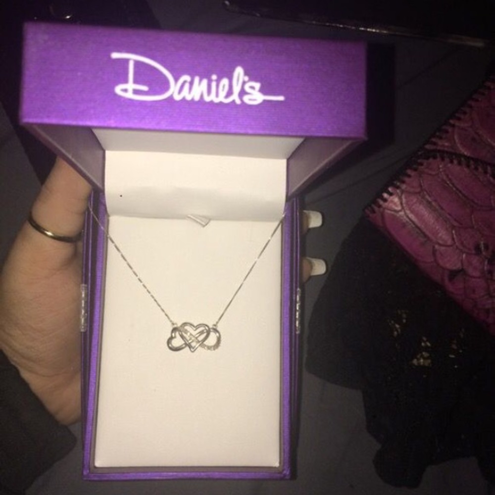 Daniels 1/16 CTW Diamond Infinity Pendant